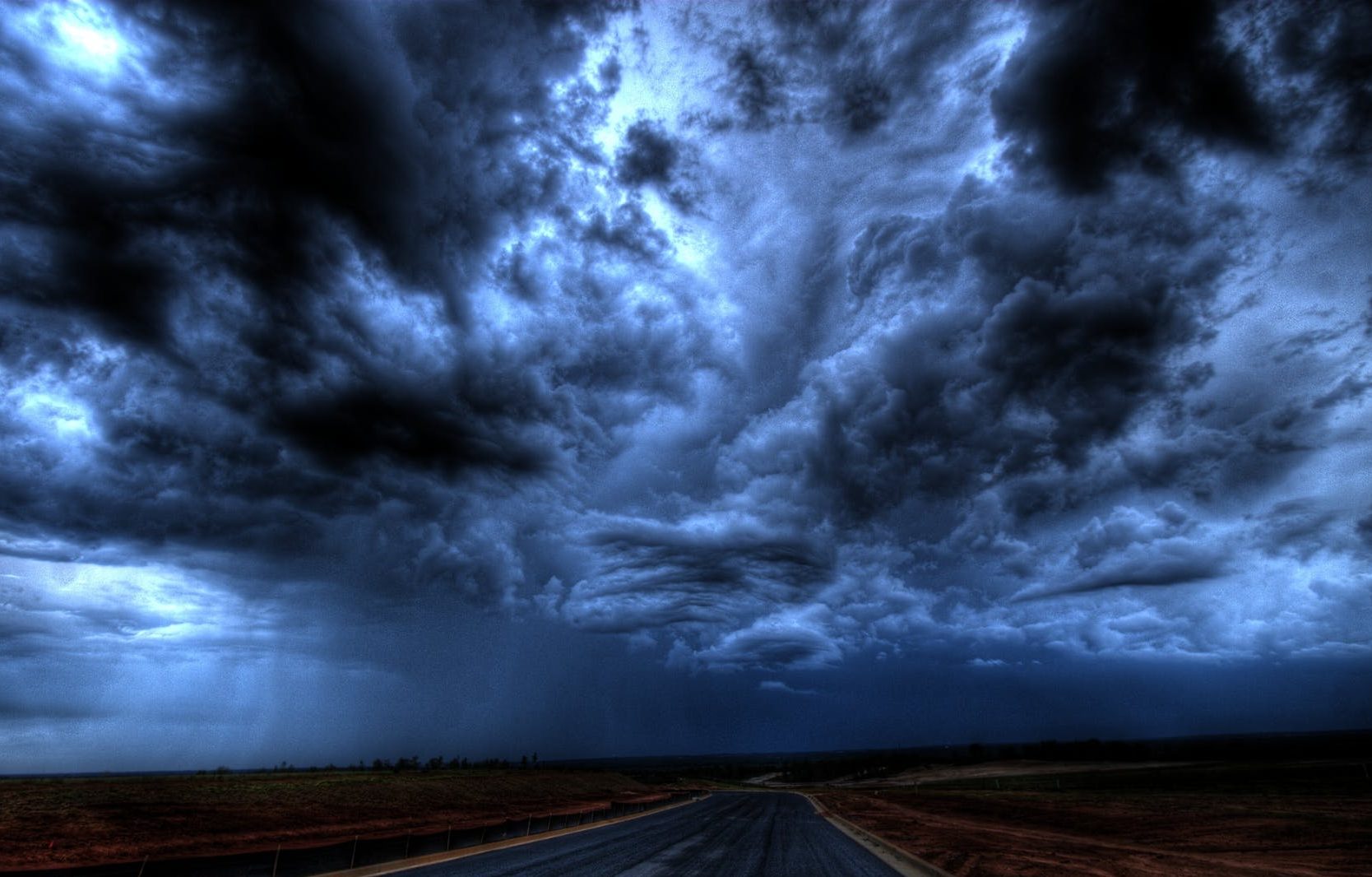 road under cloudy sky