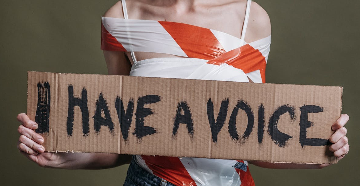 a woman holding a placard